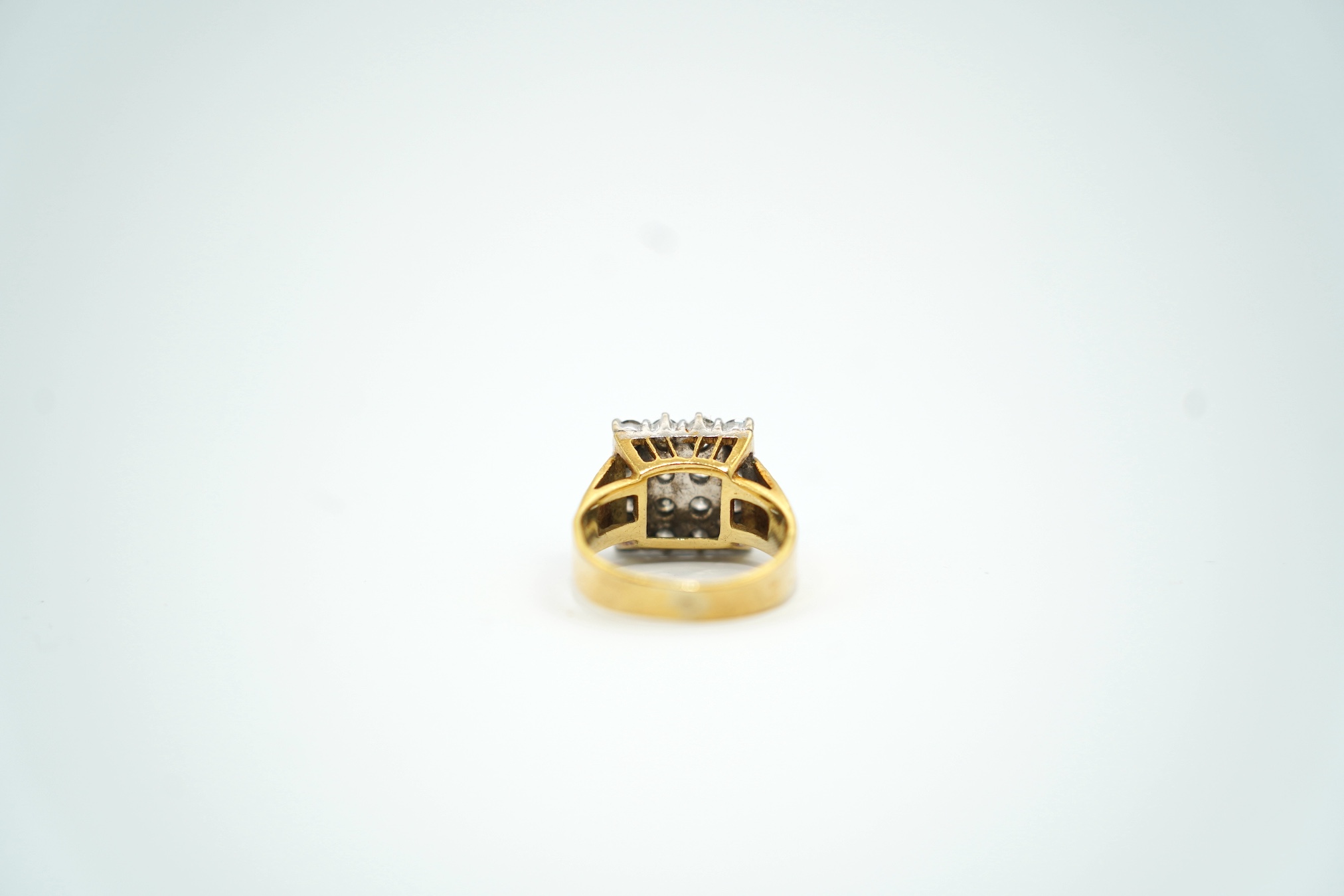 A modern textured 18ct gold and diamond cluster set tablet ring, size K/L, gross weight 6.8 grams.